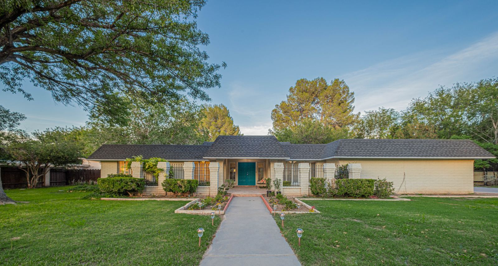 El Paso estate with green lawn